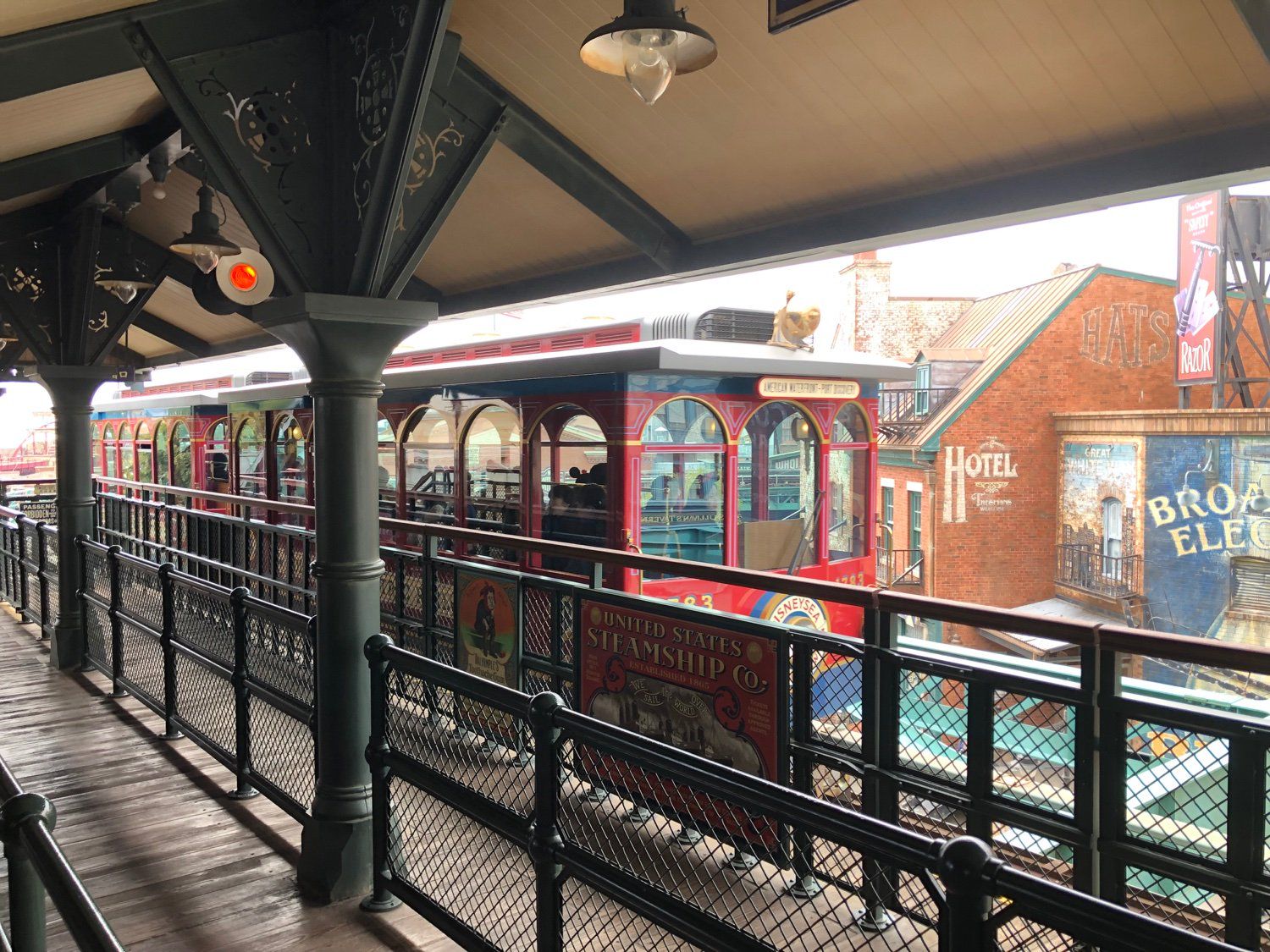 A train set seen from the boarding queue of American Waterfront Station as it pulls away, bound for Port Discovery Station.