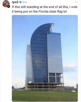 Photo of the 'i4-eyesore' building with the text from a social media app "If this is still standing at the end of all this [hurricane] it deserves to be on the Florida flag"